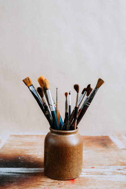 istock Paint brushes in a jar. On isolated background. 923334108
