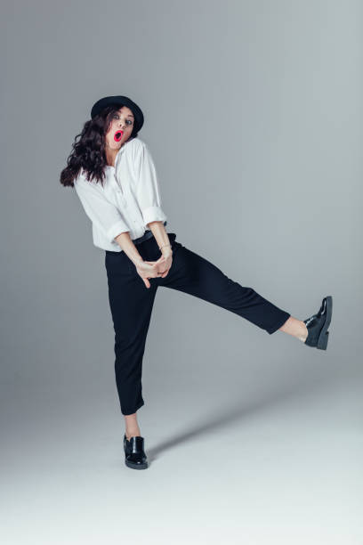 istock Young beautiful female dancer is posing in the studio 923335982