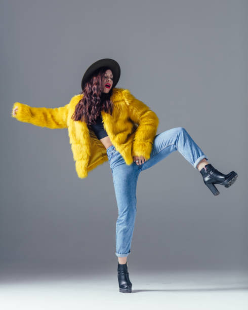 istock Young beautiful female dancer is posing in the studio 923341240