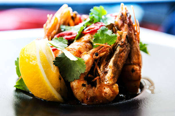 istock delicious fried shrimp with lemon and rice in white plate 923343378