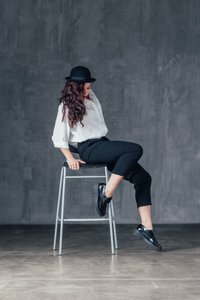 istock Young beautiful female dancer is posing in the studio 923348712