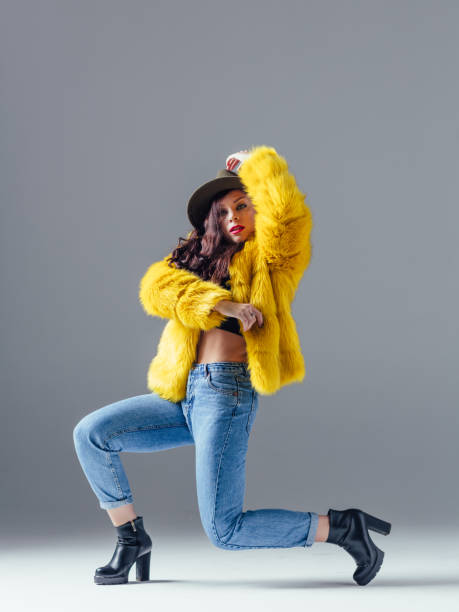 istock Young beautiful female dancer is posing in the studio 923351758
