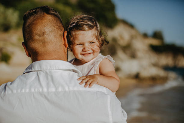 istock Dad and child daughter playing together outdoors on a summer 923352508