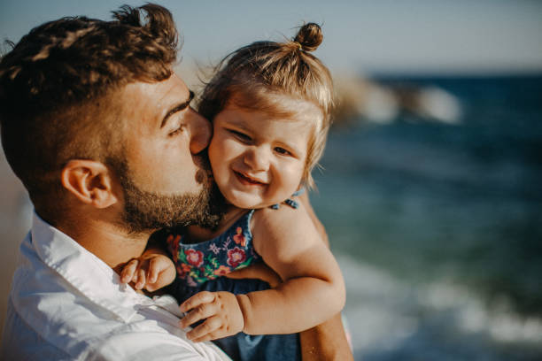 istock Dad and child daughter playing together outdoors on a summer 923352620