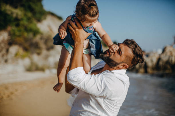 istock Dad and child daughter playing together outdoors on a summer 923352706