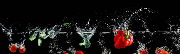 istock group of vegetables in water splash 923355210