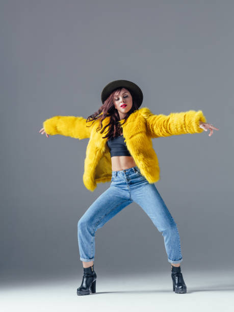 istock Young beautiful female dancer is posing in the studio 923355292