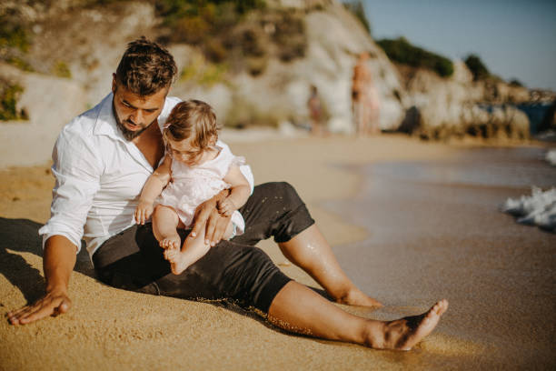istock Dad and child daughter playing together outdoors on a summer 923355390