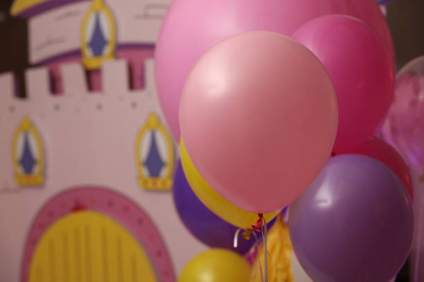 istock Helium balloons on toy house background. Selective focus 923355468
