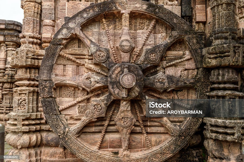 Stone wheel Intricate carvings on a stone wheel in the ancient  Hindu Sun Temple at Konark, Orissa, India. Ancient Stock Photo