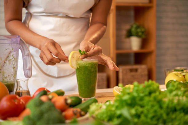 istock Garnishing glass with healthy drink 923355872
