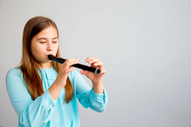 istock Girl playing flute 923359888