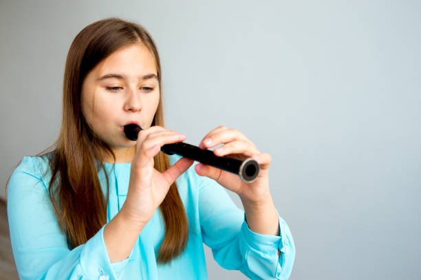 istock Girl playing flute 923359950