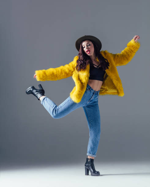 istock Young beautiful female dancer is posing in the studio 923359978