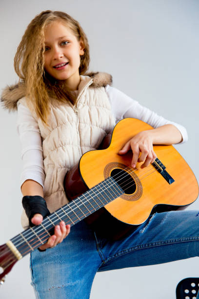 istock Girl playing guitar 923360224