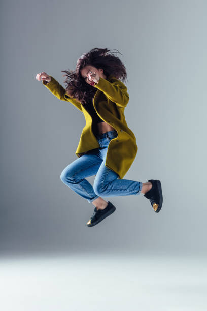istock Young beautiful female dancer is posing in the studio 923360326
