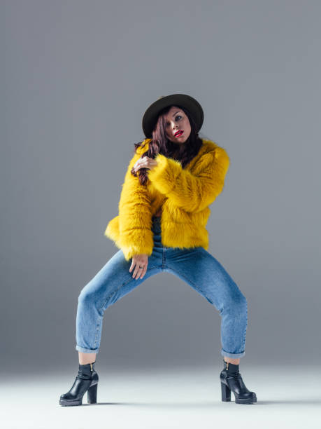 istock Young beautiful female dancer is posing in the studio 923361216