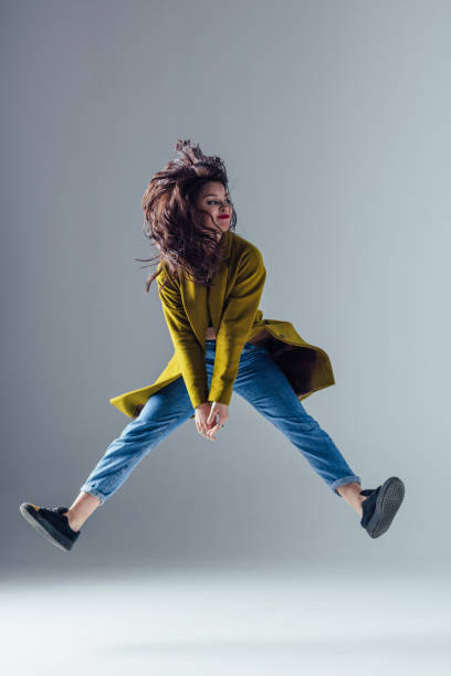 istock Young beautiful female dancer is posing in the studio 923363574