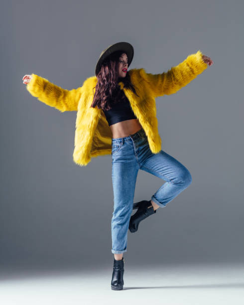 istock Young beautiful female dancer is posing in the studio 923364738