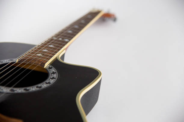 istock acoustic guitar on white background 923364836
