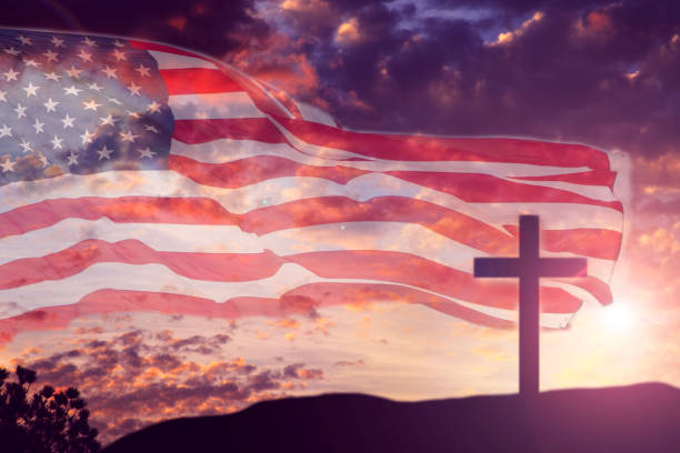 USA flag with sunset sky and Good Friday, Easter cross. stock photo