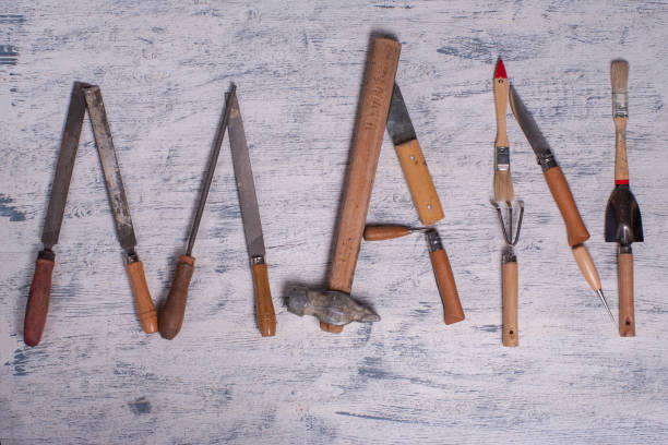 istock The word MAN is made up of a work tools 923370934