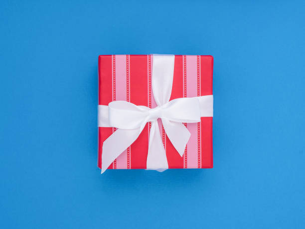 istock Wrapped gift box.  Pastel Colour flat lay minimal concept. 923372454