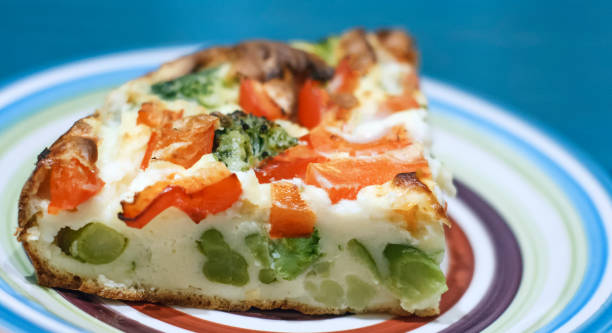 istock Slice of light Greek vegetable pie with cheese, broccoli and red pepper 923379472