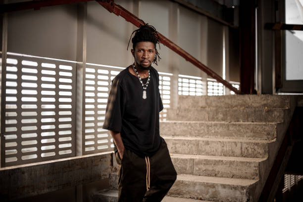 istock Afro american man standing on the stairs 923383258