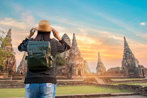 beautiful  hipster travel relaxing at Ayutthaya historical park thailand during sunset time