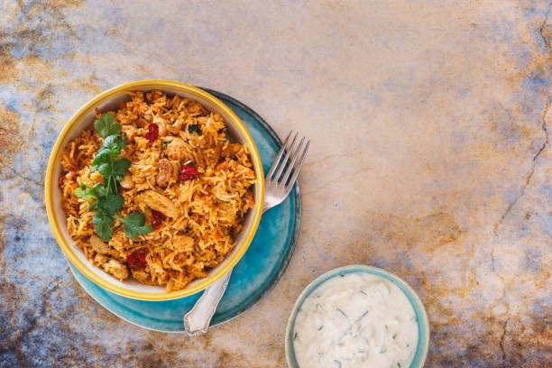 istock Delicious Indian biryani with cucumber raita side dish 923387252