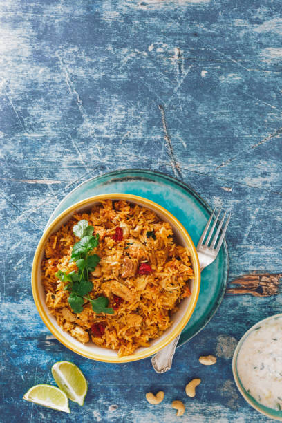 istock Indian Biryani rice dish with chicken meat, curry, cashew nuts and saffron 923387630