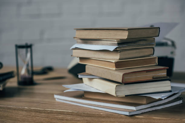 istock close-up shot of stacked books on work desk 923390982
