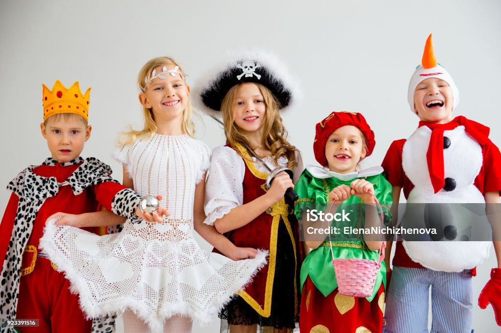 Kids costume party Several kids in different costumes having party Child Stock Photo