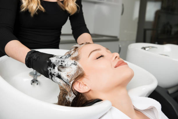 Washing Hair Woman is having a hair wash. washing hair stock pictures, royalty-free photos & images