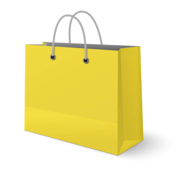 istock Yellow paper classic shopping bag isolated on white background 923397096