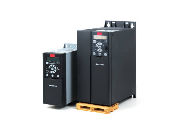 A group of two different sizes and capacities new universal inverter for controlling the electric current and power for industrial on a isolated white background. A frequency converter - rectifier - power stabilizer. un grupo de dos diferentes tamaños y capacidades nuevo universal inversor para el control de la eléctrica corriente y potencia para la industrial en un fondo blanco aislado. un estabilizador de la energía de frecuencia convertidor - rectificador-