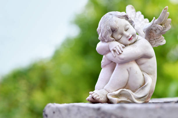 istock Guardian angel sleeping on the grave 923397572