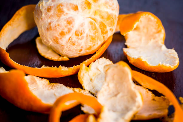 Close up of fresh ripe oranges,Citrus aurantium without peel on wooden surface.; stock photo