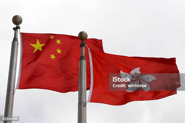 Foto de Bandeira De China E Em Hong Kong e mais fotos de stock de Bandeira - Bandeira, Bandeira Chinesa, Bandeira de Hong Kong