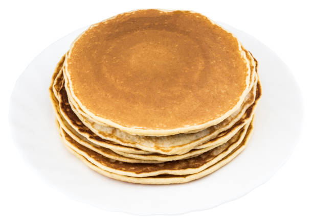 istock Stack of delicious pancakes on plate isolated on white 923405188