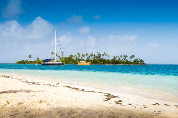 istock Two small boats in front of a Caribbean islands 923410090