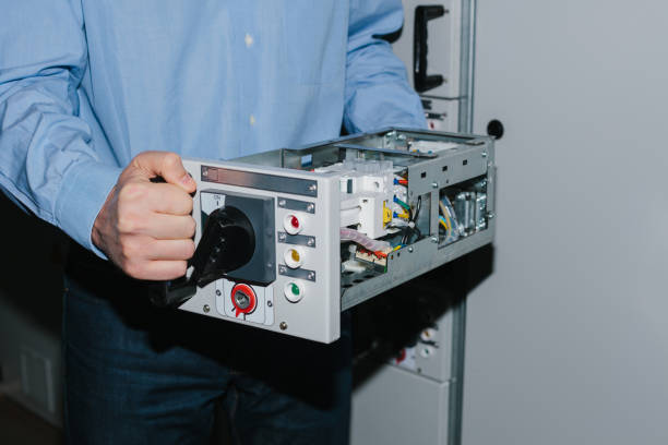 istock Electrician specialist checking low-voltage cabinet equipment 923410360