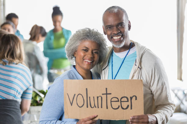 istock Retired couple volunteer during charity event 923413016