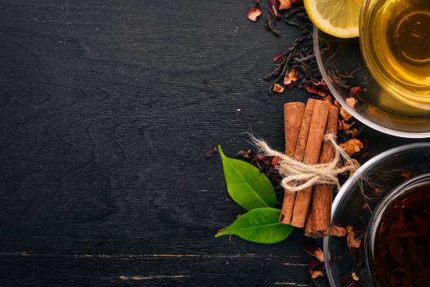 istock Black and green tea with lemon, honey, cinnamon and ginger. Hot drink Top view. Copy space. 923413090