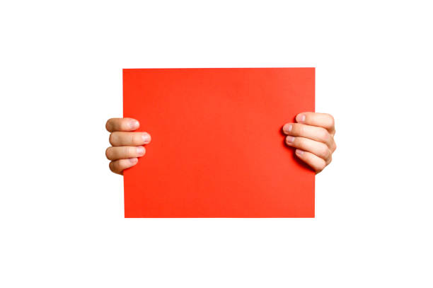 two hands are holding an empty frame on a red background, place for an inscription
