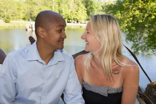 loving mixed couple in outdoor park