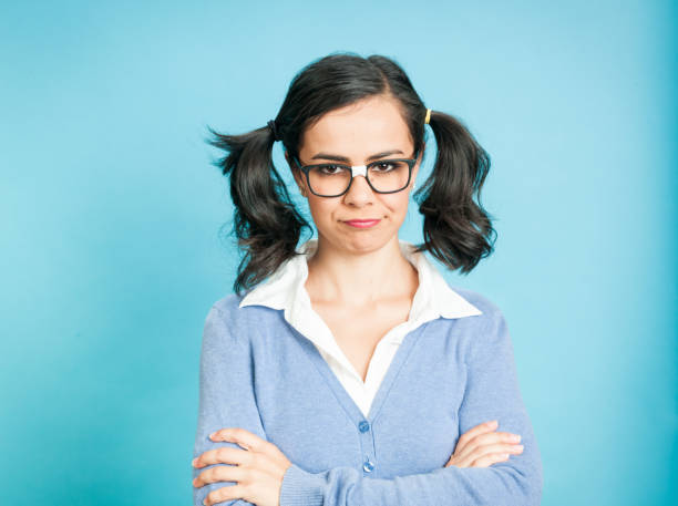 istock Nerdy Woman Against Blue Background 923421930