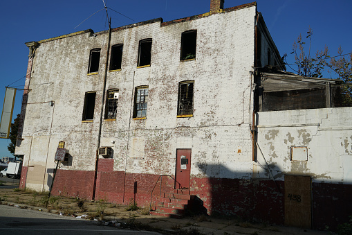 Cairo, West Virginia, USA - March 20, 2023: The ruins of the abandoned former Cairo High School on a sunny day.