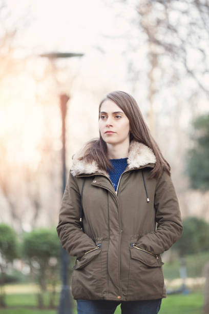 istock Young Girl walking alone in the park 923423052